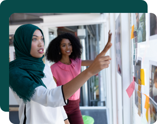 MikMak Book a Demo Woman pointing at collaboration board